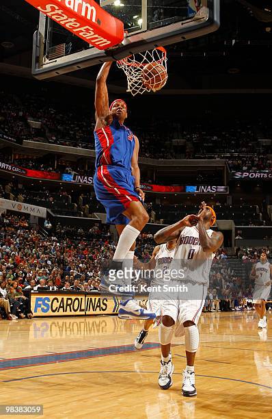 Charlie Villanueva of the Detroit Pistons blocks against Larry Hughes of the Charlotte Bobcats on April 10, 2010 at the Time Warner Cable Arena in...
