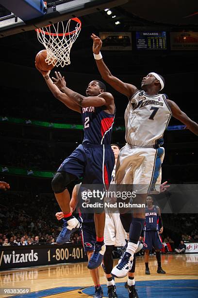 Joe Johnson of the Atlanta Hawks shoots against Andray Blatche of the Washington Wizards at the Verizon Center on April 10, 2010 in Washington, DC....