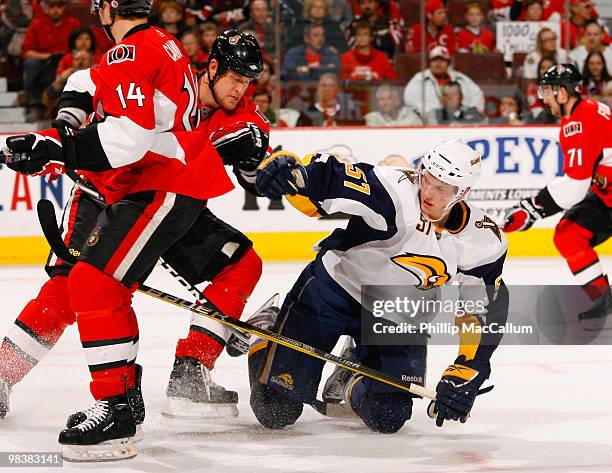 Andy Sutton of the Ottawa Senators knocks down Tyler Myers of the Buffalo Sabres in a game at Scotiabank Place on April 10, 2010 in Ottawa, Canada....