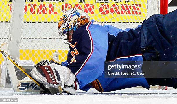 Goaltender Johan Hedberg of the Atlanta Thrashers saves a shot on goal by the Pittsburgh Penguins at Philips Arena on April 10, 2010 in Atlanta,...