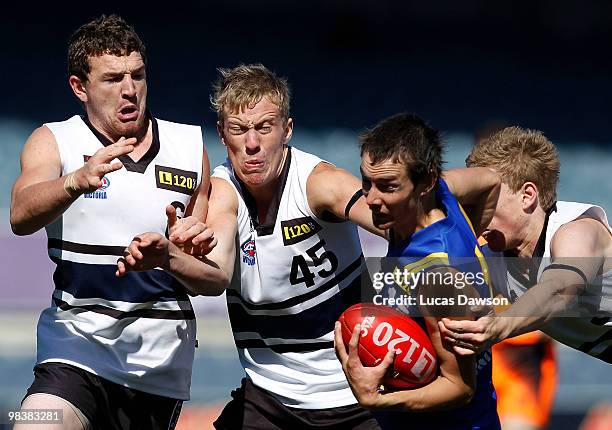 Jack Gray of the Jets breaks a tackle during the round three TAC Cup match between Northeren Knights and Western Jets on April 11, 2010 in Melbourne,...