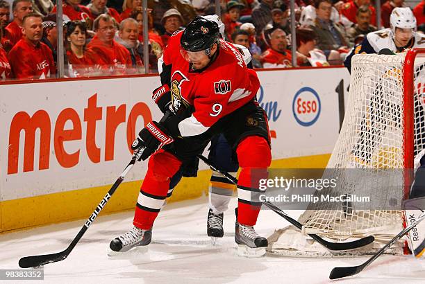 Milan Michalek of the Ottawa Senators tries to cut around the net with the puck in a game against the Buffalo Sabres at Scotiabank Place on April 10,...