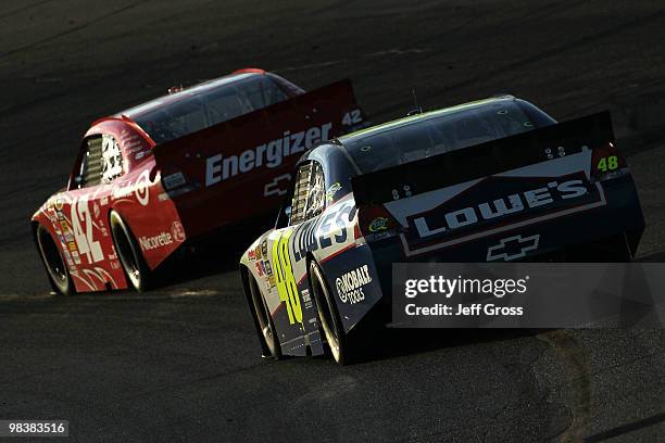 Juan Pablo Montoya, driver of the Target Chevrolet, drives ahead of Jimmie Johnson, driver of the Lowe's Chevrolet, during the NASCAR Sprint Cup...