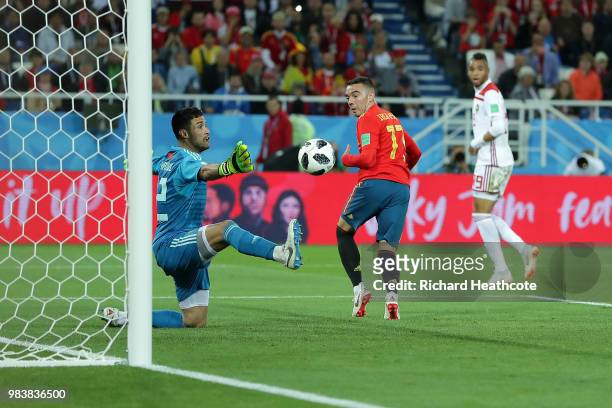 Iago Aspas of Spain back heels in past Monir El Kajoui of Morocco to score his sides second goal during the 2018 FIFA World Cup Russia group B match...