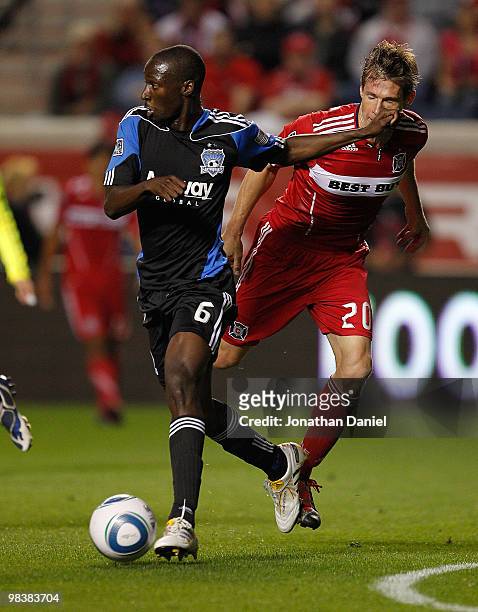 Brian McBride of the Chicago Fire is hit in the mouth by Ike Opara of the San Jose Earthquakes in an MLS match on April 10, 2010 at Toyota Park in...