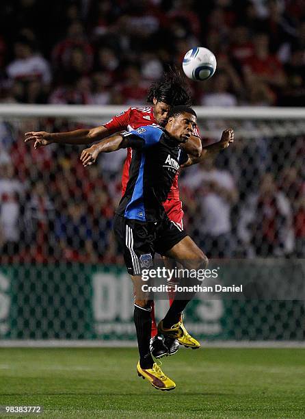 Ryan Johnson of the San Jose Earthquakes and Wilman Conde of the Chicago Fire battle for a header in an MLS match on April 10, 2010 at Toyota Park in...