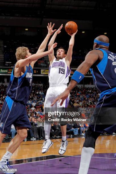 Beno Udrih of the Sacramento Kings shoots the ball over Dirk Nowitzki of the Dallas Mavericks on April 10, 2010 at ARCO Arena in Sacramento,...