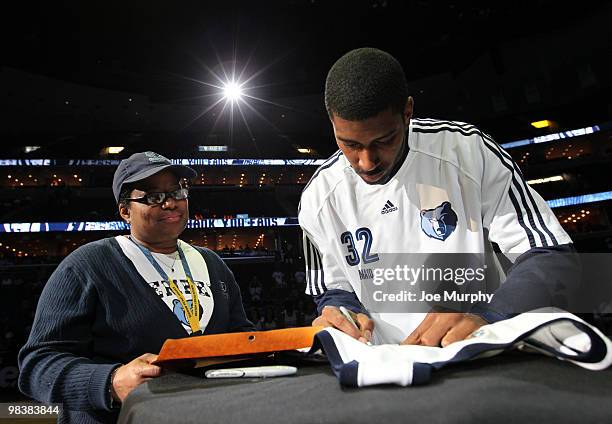 Mayo of the Memphis Grizzlies signs his jersey for a fan after a game against the Philadelphia 76ers on April 10, 2010 at FedExForum in Memphis,...