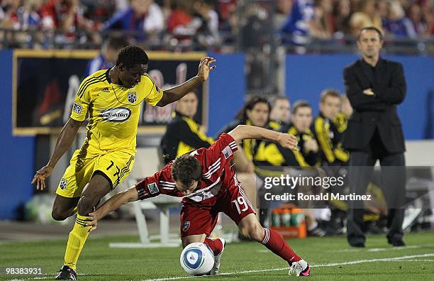 Defender Zach Loyd of FC Dallas dribbles the ball against Emmanuel Ekpo of the Columbus Crew at Pizza Hut Park on April 10, 2010 in Frisco, Texas.