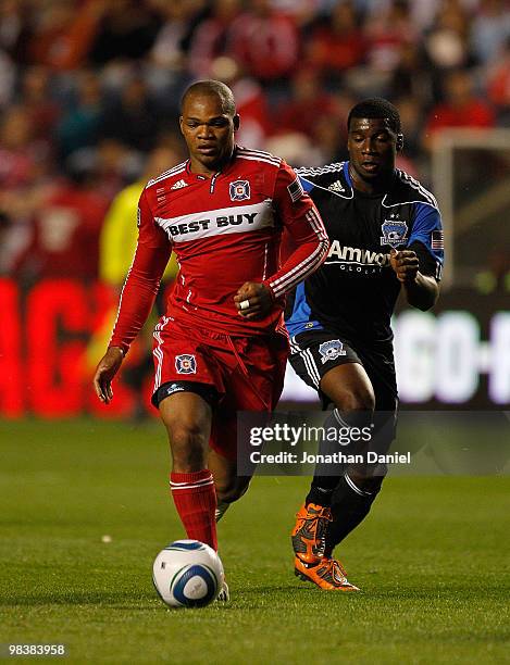 Collins John of the Chicago Fire moves past Ramon Sanchez of the San Jose Earthquakes in an MLS match on April 10, 2010 at Toyota Park in Brideview,...