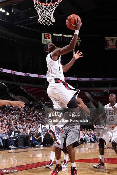 Kyrie Irving of the USA Junior National Select Team goes up for a shot in a game against the World Select Team on April 10, 2010 at the Rose Garden...