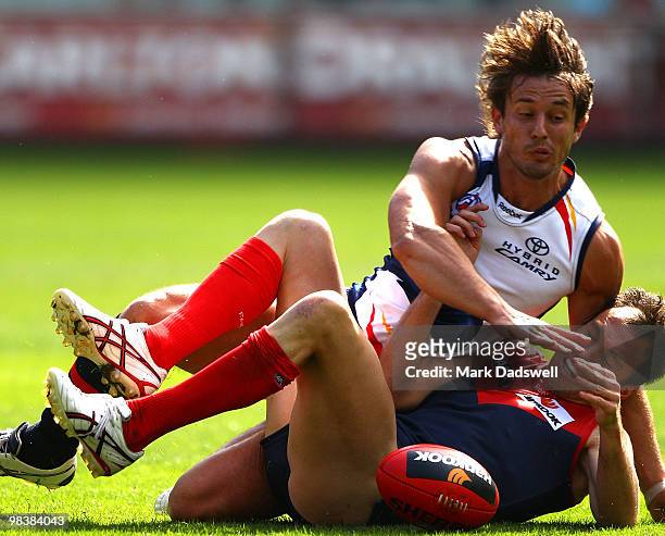 Ivan Maric of the Crows tackles Brad Green of the Demons during the round three AFL match between the Melbourne Demons and the Adelaide Crows at...