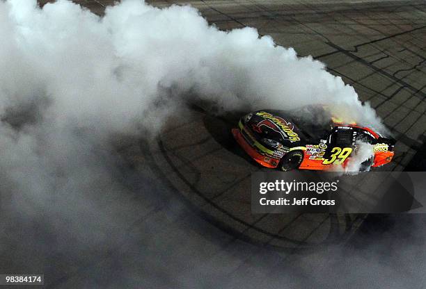 Ryan Newman, driver of the Tornados Chevrolet, celebrates with a burn out after winning the NASCAR Sprint Cup Series SUBWAY Fresh Fit 600 at Phoenix...