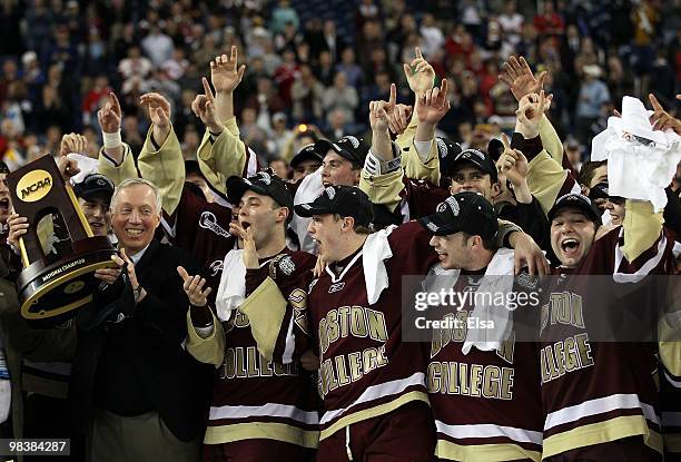 Head coach Jerry York and the rest of the Boston College Eagles celebrate with the trophy after they won the championship game of the 2010 NCAA...