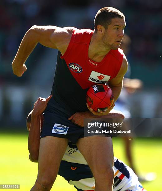 Andrew McLeod of the Crows tackles James Frawley of the Demons during the round three AFL match between the Melbourne Demons and the Adelaide Crows...