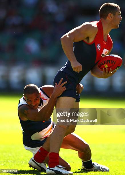 Andrew McLeod of the Crows tackles James Frawley of the Demons during the round three AFL match between the Melbourne Demons and the Adelaide Crows...