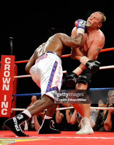 Evander Holyfield knocks Francois Botha to the canvas in the eighth round of their heavyweight bout shortly before Holyfield won by TKO at the Thomas...