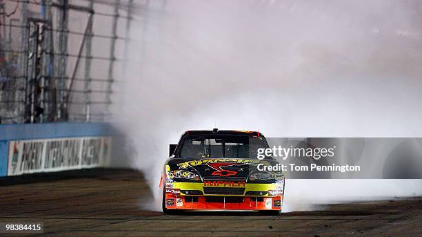 Ryan Newman, driver of the Tornados Chevrolet, celebrates with a burn out after winning the NASCAR Sprint Cup Series SUBWAY Fresh Fit 600 at Phoenix...