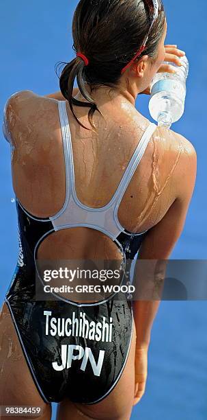 Akane Tsuchihashi of Japan cools off after finishing the women's event at the Sydney round of the ITU World Championship Triathlon Series elite on...