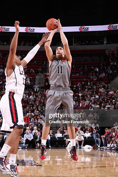 Enes Kanter of the World Select Team takes a shot over Jared Sullinger of the USA Junior National Select Team on April 10, 2010 at the Rose Garden...