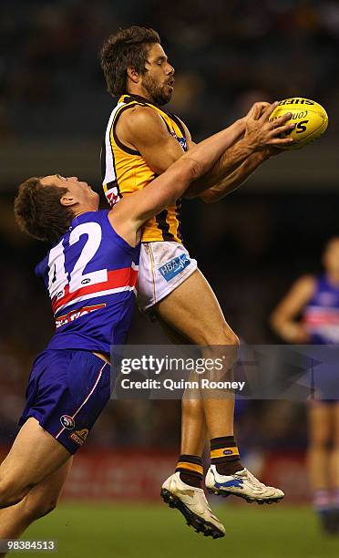 Chance Bateman of the Hawks marks infront of Liam Picken of the Bulldogs during the round three AFL match between the Western Bulldogs and the...