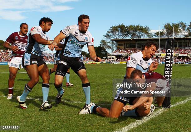 Michael Robertson of the Sea Eagles scores a try during the round five NRL match between the Manly Sea Eagles and the Cronulla Sharks at Brookvale...
