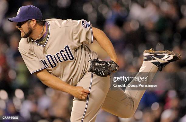 Relief pitcher Heath Bell of the San Diego Padres delivers against the Colorado Rockies in the 14th inning during MLB action at Coors Field on April...
