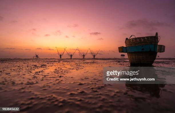 sunset on the beach with beautiful reflecion and sky - jethuynh stock pictures, royalty-free photos & images
