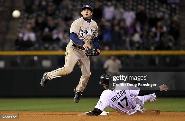 Second baseman David Eckstein of the San Diego Padres turns a double play on Todd Helton of the Colorado Rockies on a grounder by Troy Tulowitzki to...