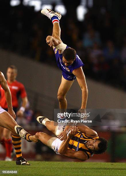 Jarrod Harbrow of the Bulldogs clashes with Jordan Lewis of the Hawks during the round three AFL match between the Western Bulldogs and the Hawthorn...