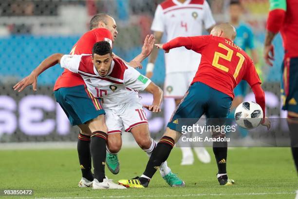 Andres Iniesta and David Silva of Spain and Younes Belhanda of Morocco in action during the 2018 FIFA World Cup Russia group B match between Spain...