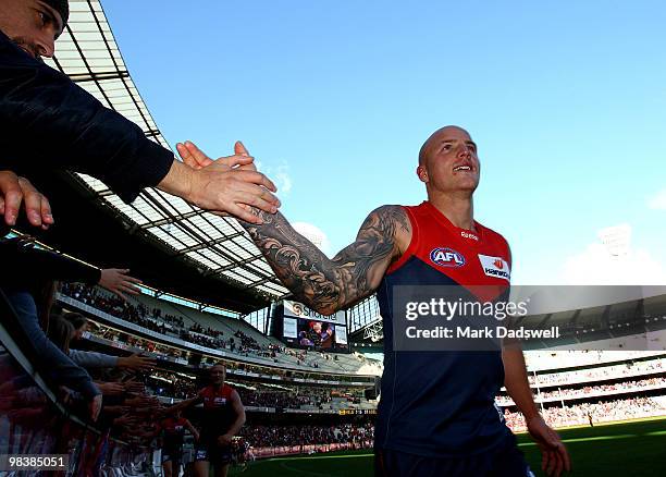 Nathan Jones of the Demons celebrates with fans after his team won the round three AFL match between the Melbourne Demons and the Adelaide Crows at...