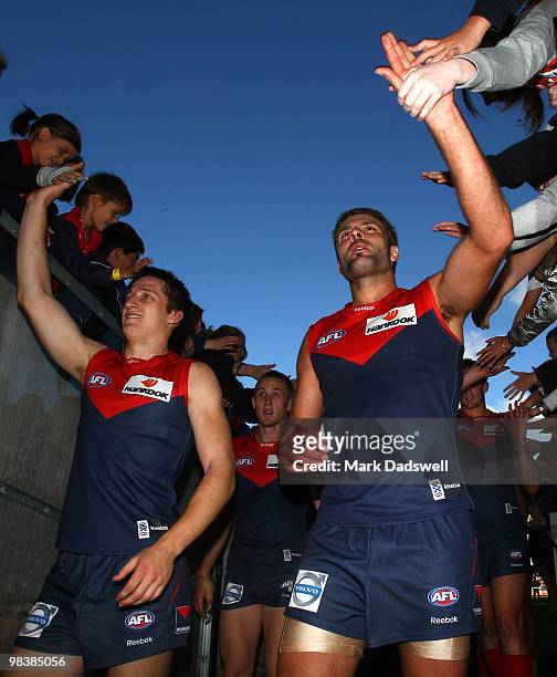Mark Jamar of the Demons celebrates with fans after his team won the round three AFL match between the Melbourne Demons and the Adelaide Crows at...