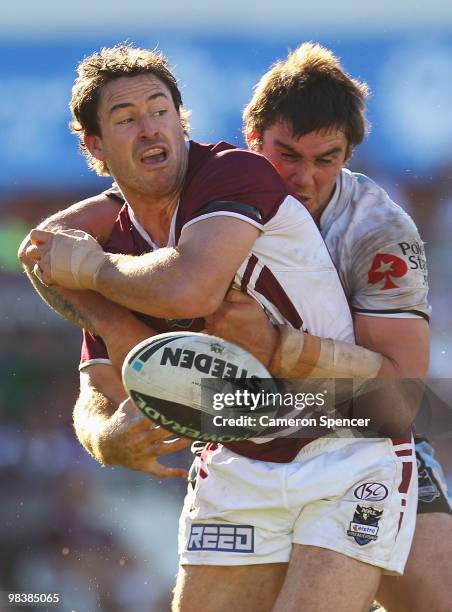 Chris Bailey of the Sea Eagles is tackled during the round five NRL match between the Manly Sea Eagles and the Cronulla Sharks at Brookvale Oval on...