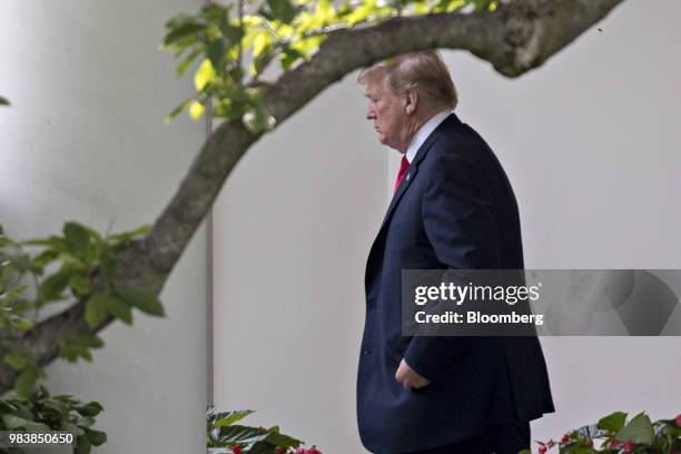 President Donald Trump walks out of the Oval Office of the White House before boarding Marine One on the South Lawn in Washington, D.C., U.S., on...