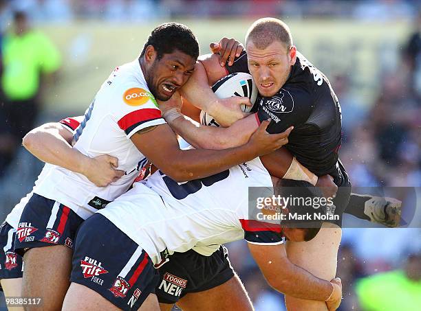 Luke Lewis of the Panthers is tackled during the round five NRL match between the Penrith Panthers and the Sydney Roosters at CUA Stadium on April...