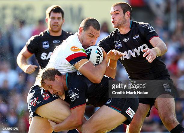 Jason Ryles of the Roosters is tackled during the round five NRL match between the Penrith Panthers and the Sydney Roosters at CUA Stadium on April...