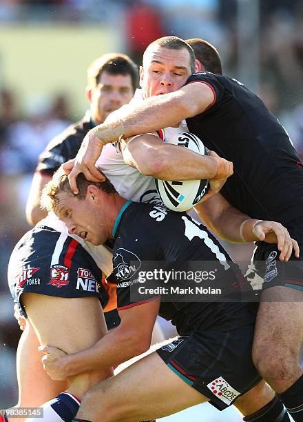 Jason Ryles of the Roosters is tackled during the round five NRL match between the Penrith Panthers and the Sydney Roosters at CUA Stadium on April...