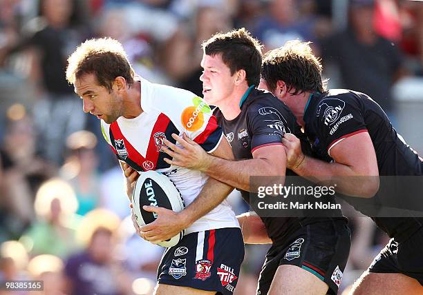 Phil Graham of the Roosters is tackled by Lachlan Coote and Trent Waterhouse of the Panthers during the round five NRL match between the Penrith...