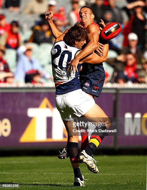Brad Green of the Demons attempts to spoil Ivan Maric of the Crows during the round three AFL match between the Melbourne Demons and the Adelaide...