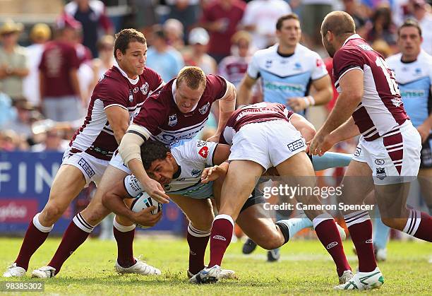 Blake Ferguson of the Sharks is tackled during the round five NRL match between the Manly Sea Eagles and the Cronulla Sharks at Brookvale Oval on...