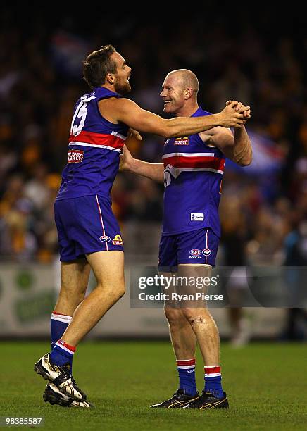 Barry Hall and Ben Hudson of the Bulldogs celebrate a goal during the round three AFL match between the Western Bulldogs and the Hawthorn Hawks at...