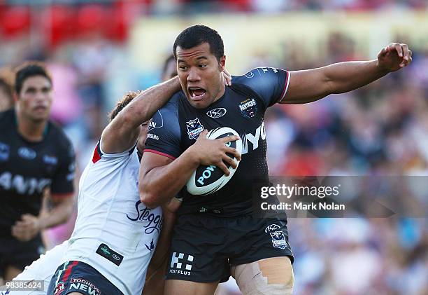 Joseph Paulo of the Panthers is tackled during the round five NRL match between the Penrith Panthers and the Sydney Roosters at CUA Stadium on April...