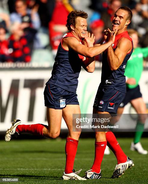 James McDonald of the Demons celebrates a goal with Brad Green during the round three AFL match between the Melbourne Demons and the Adelaide Crows...