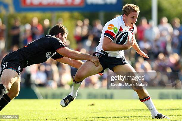 Mitchell Aubusson of the Roosters is tackled during the round five NRL match between the Penrith Panthers and the Sydney Roosters at CUA Stadium on...