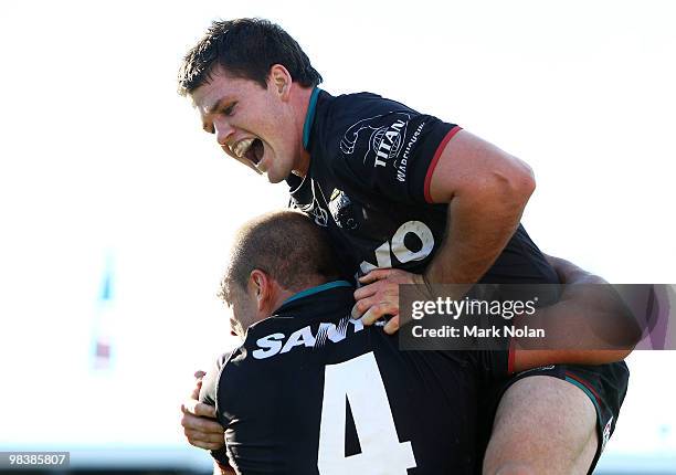 Lachlan Coote of the Pantehrs celebrates with Adrian Purtell after a try during the round five NRL match between the Penrith Panthers and the Sydney...