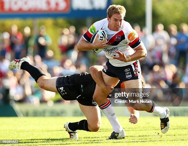 Mitchell Aubusson of the Roosters is tackled during the round five NRL match between the Penrith Panthers and the Sydney Roosters at CUA Stadium on...