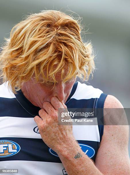 Cameron Ling of the Cats leaves the field with an injury during the round three AFL match between Fremantle Dockers and the Geelong Cats at Subiaco...