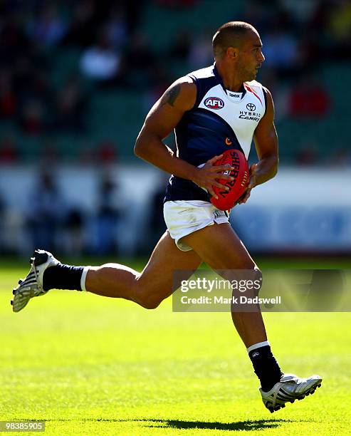 Andrew McLeod of the Crows runs with the ball during the round three AFL match between the Melbourne Demons and the Adelaide Crows at Melbourne...