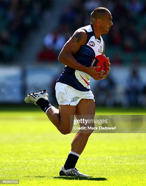 Andrew McLeod of the Crows runs with the ball during the round three AFL match between the Melbourne Demons and the Adelaide Crows at Melbourne...